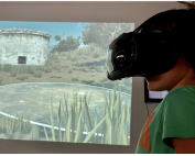 Child doing VR tour of Choirokoitia